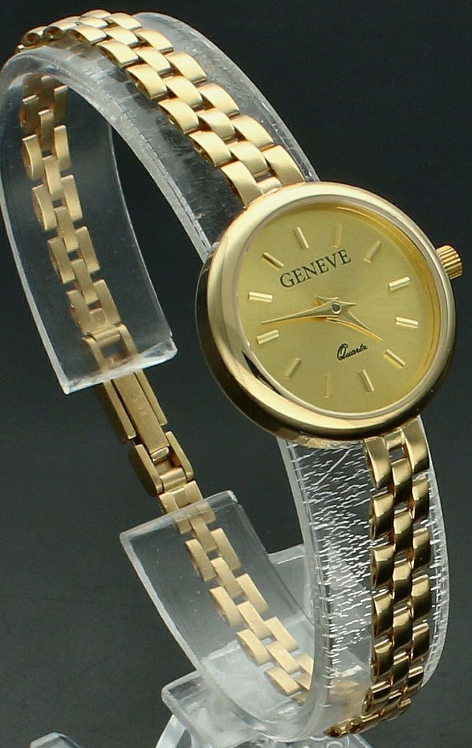 Zegarek złoty GENEVE ZG 200 585 Złoty zegarek Geneve damski wysokiej próby 585 o łącznej masie 19,60 gram złota ZG 200 585. Czasomierz posiada tarczę w nieskazitelnym złotym kolorze emanującą subtelnością.1.jpg